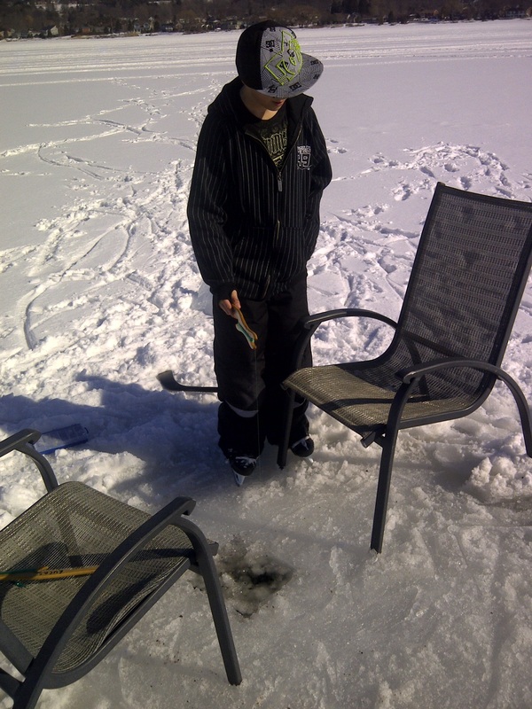 Ice Fishing in front on the cottage rental Ontario.